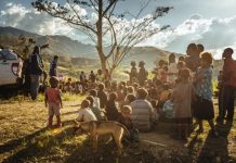 tree-children-men-migration-dog-sky-clouds