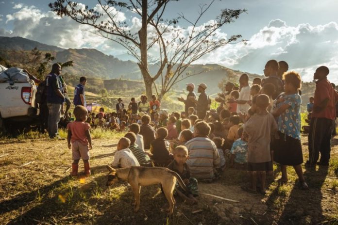 tree-children-men-migration-dog-sky-clouds