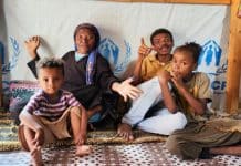 un-family-sitting-carpet-childre-mother-Yemen-support