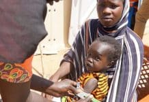 Aid in Sudan- child and woman