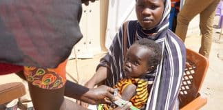 Aid in Sudan- child and woman