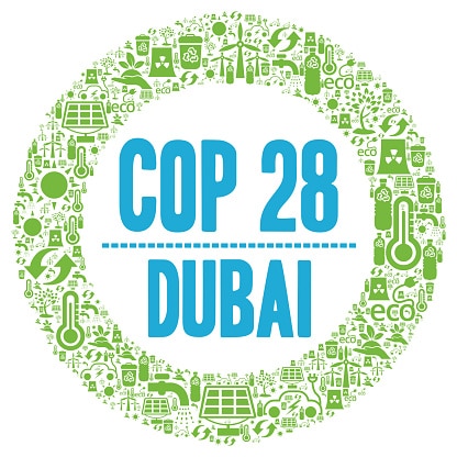 Logo for COP28 i Dubai UAE der er grønt og blå