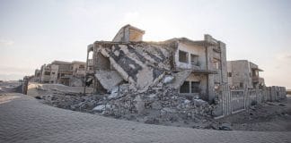 Conflict-damaged homes on the edge of Aden, Yemen.