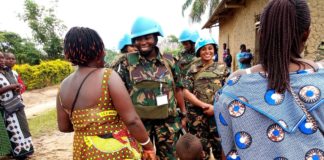 Tanzanian female peacekeepers interact with women in Beni, DRC.