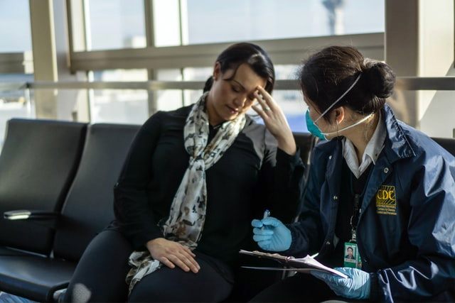 Person speaking to a CDC officer - Mental Health and COVID-19