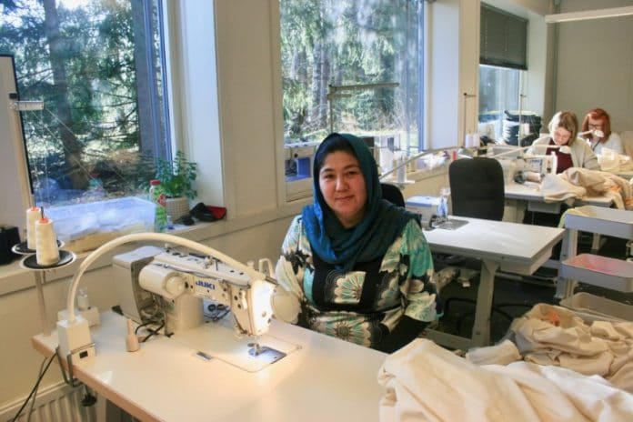 Seamstress at work, sisters in business, Smittevern