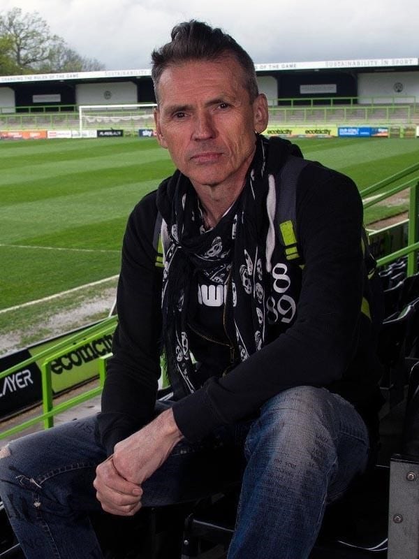 Dale Vince sitting in football stadium