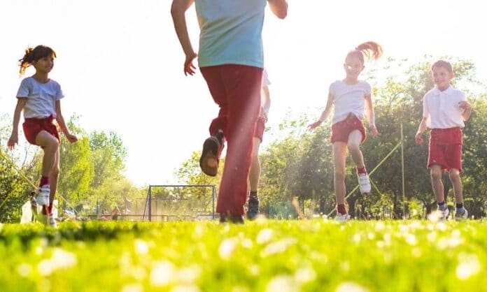 Children exercising on a pitch