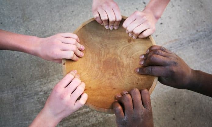 Hands holding an empty bowl