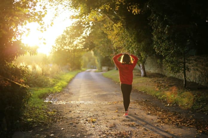 Person walking at sunrise