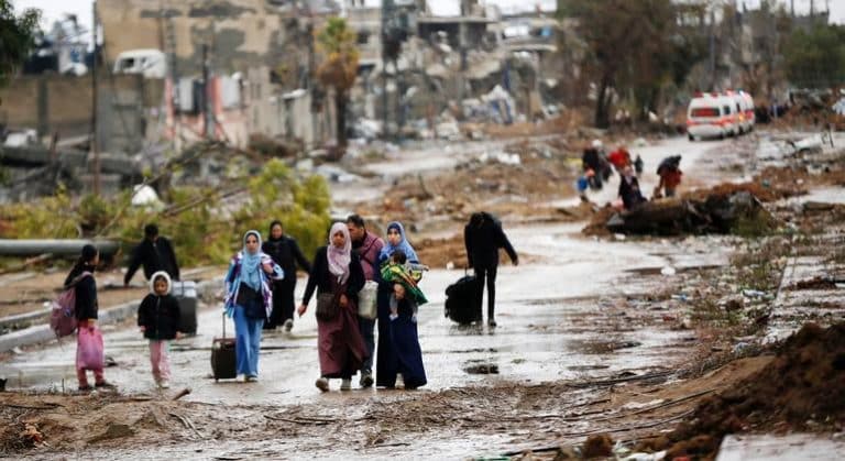 UNRWA. Displaced people walk from the north of Gaza towards the south, as ambulances head in the other direction.