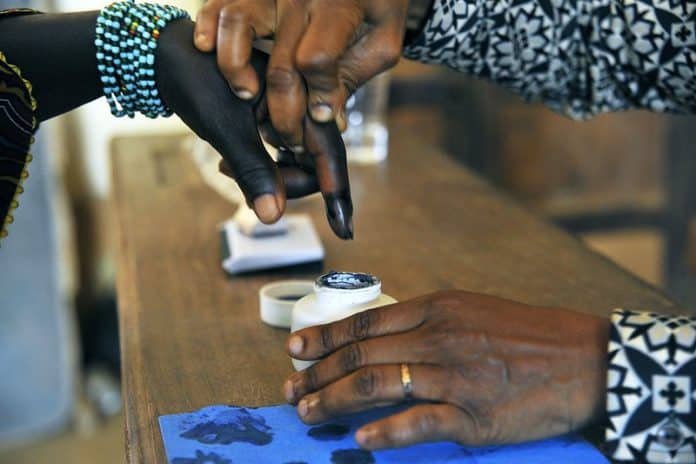 A woman has her finger dipped ink after voting in legislative by-elections in Grand Laho, Côte d′Ivoire (Photo: UN/Hien Macline)