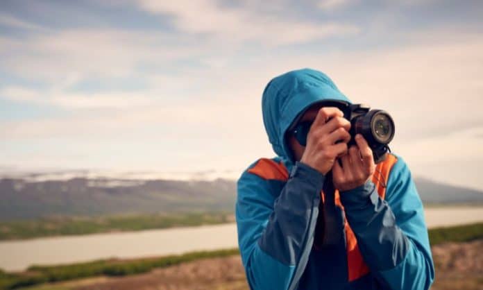 Canva stock photo of a photographer in the wilderness