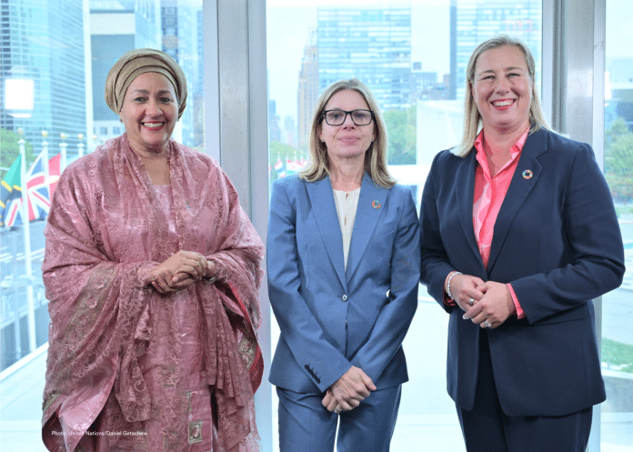 Three women smiling