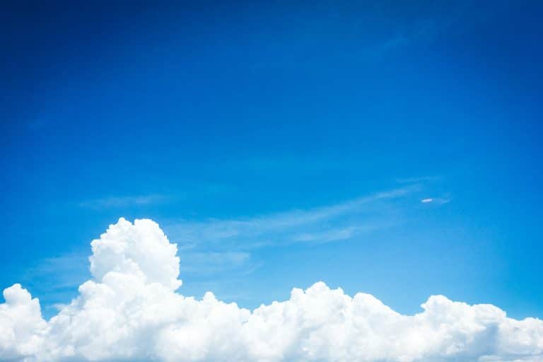 Photo of blue skies with some clouds. via Unsplash