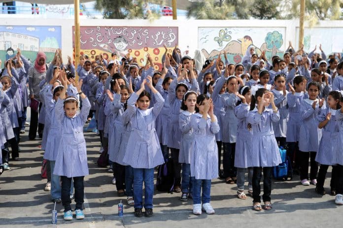 Before the 2022 war. Young Palestinian girls in Gaza, gathered in the courtyard of their school supported by UNRWA. Photo:  UN Photo/Shareef Sarhan