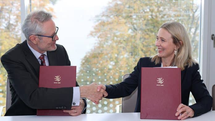 A woman and a man shaking hands