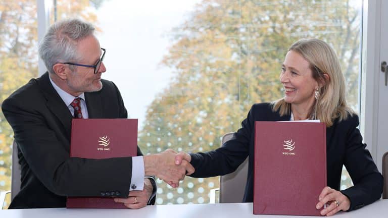 A woman and a man shaking hands