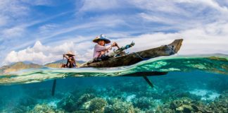 Image d'un pêcheur sur une pirogue