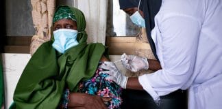 A woman receives a dose of a COVID-19 vaccine at a health clinic in Garowe, Somalia.