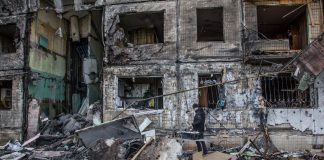 A shelling partially destroyed a block of flats in Obolon district