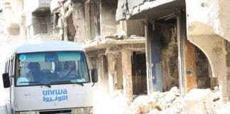 UNRWA transports Palestine refugee students from Yarmouk refugee camp to schools in neighboring areas in Damascus, Syria.