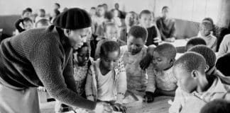 Young school children in a classroom in the village of Cross Roads, South Africa