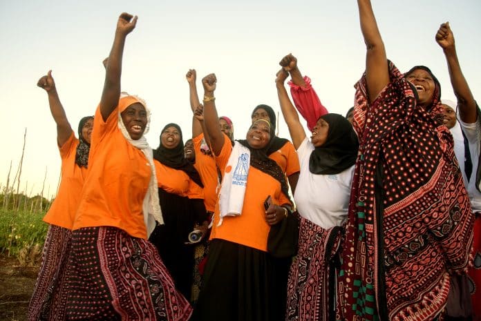 In this picture, women in Tanzania are cheering up