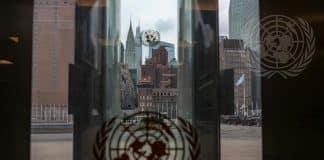 A view of the Empire State Building through the glass doors at UN Headquarters