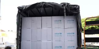 Bottled water and emergency hygiene kits are distributed at a school in Beirut, Lebanon.