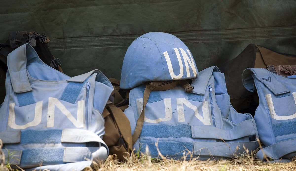 blue helmets and vests