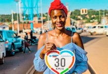 Woman holding speed limit sign